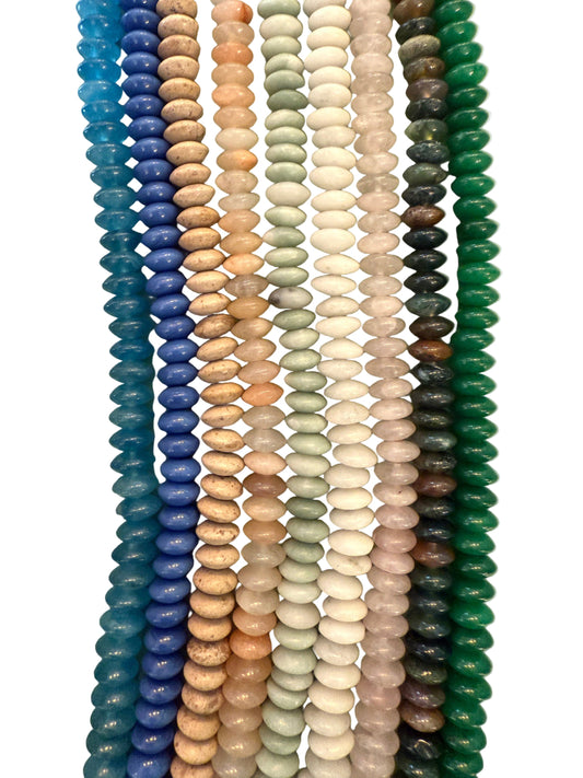 Close-up of colorful beads on a light green background