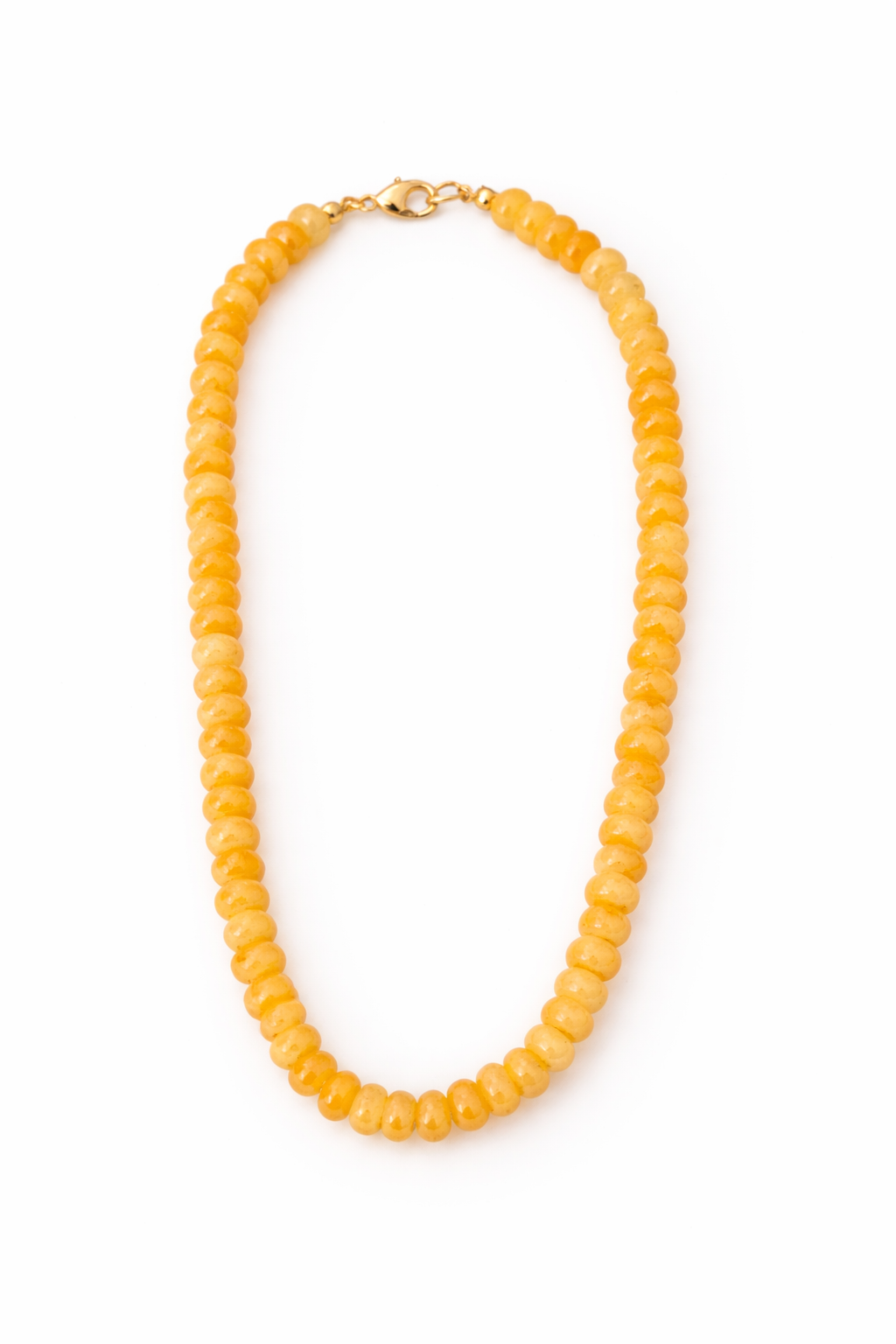 Yellow beaded necklace on a white background