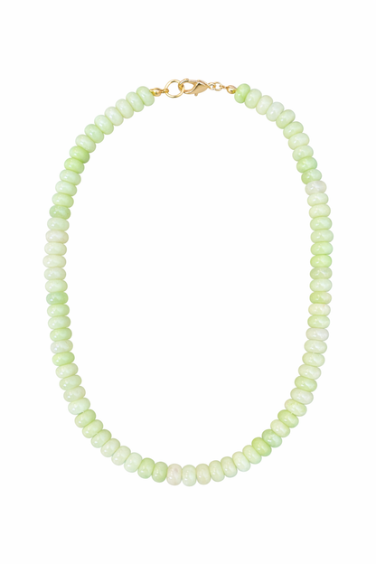 Necklace with light green beads on a white background