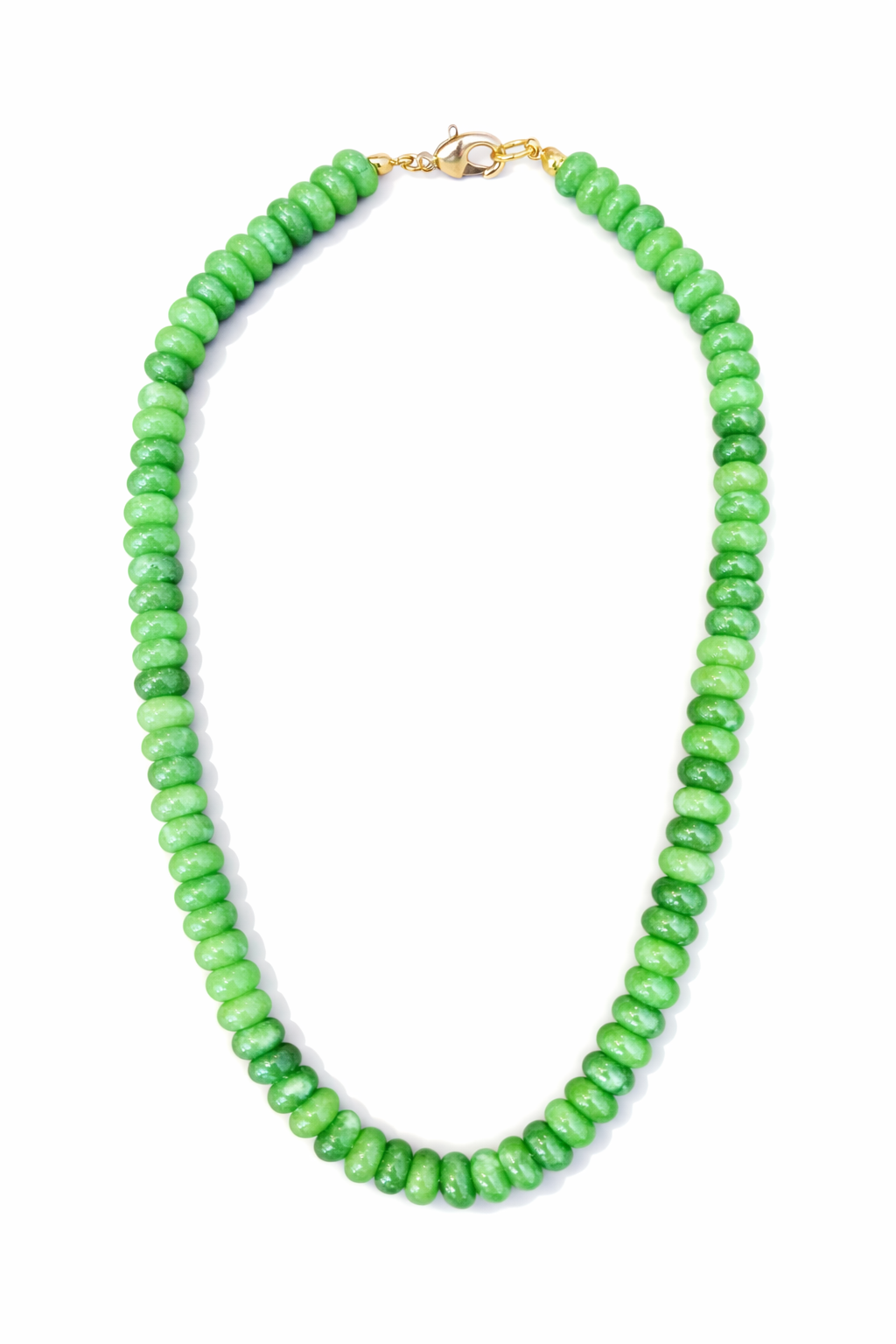 Green beaded necklace on a white background