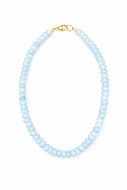 Necklace with light blue beads on a white background