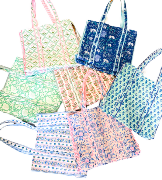 Collection of patterned bags on a white background