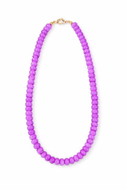 Purple beaded necklace on a white background